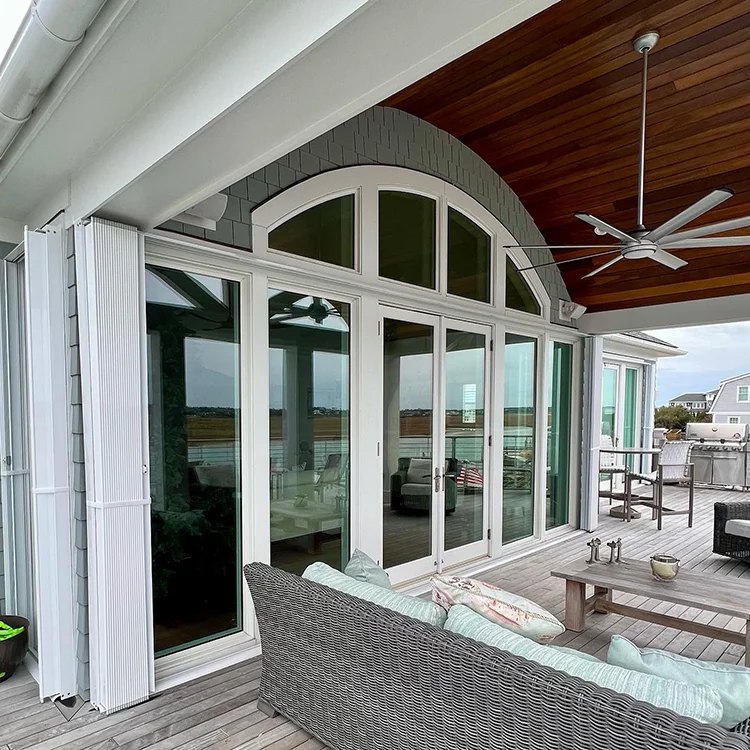 Accordion hurricane shutters installed on a Carolina Beach area home