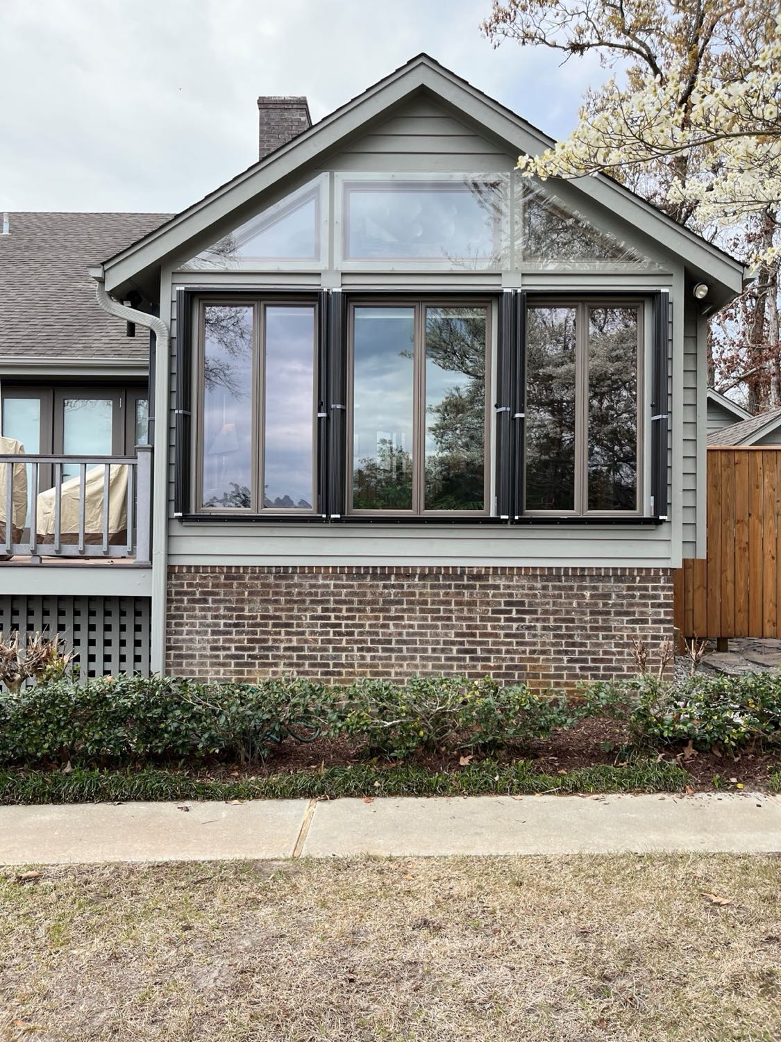 Accordion hurricane shutters on an Oak Island area beach house