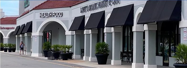 Stationary fabric awning over a storefront