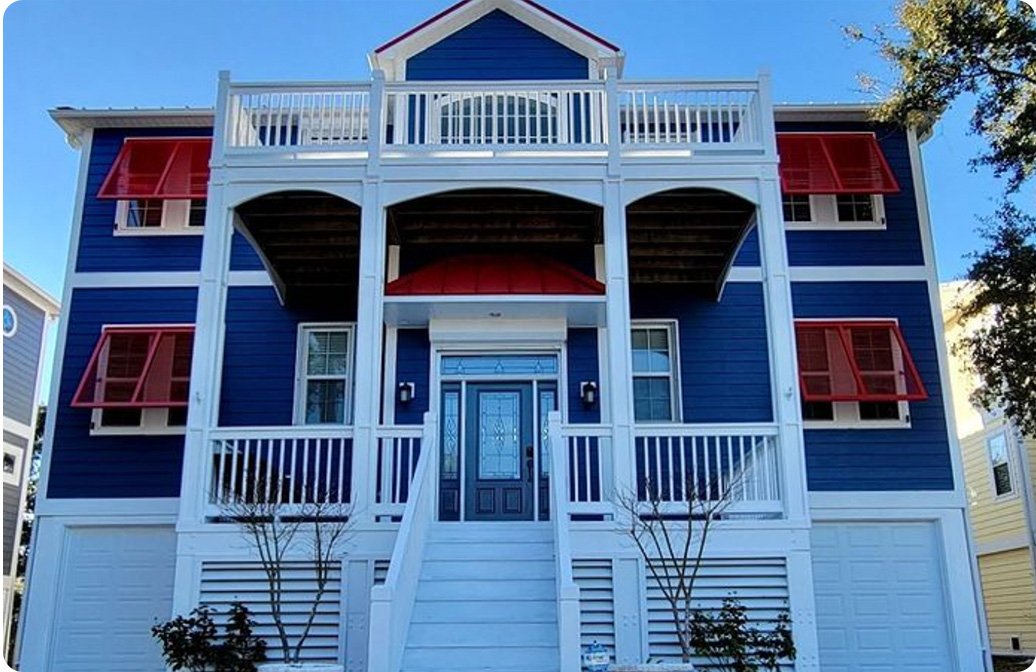 Aluminum Bahama shutters shading the windows of a coastal home