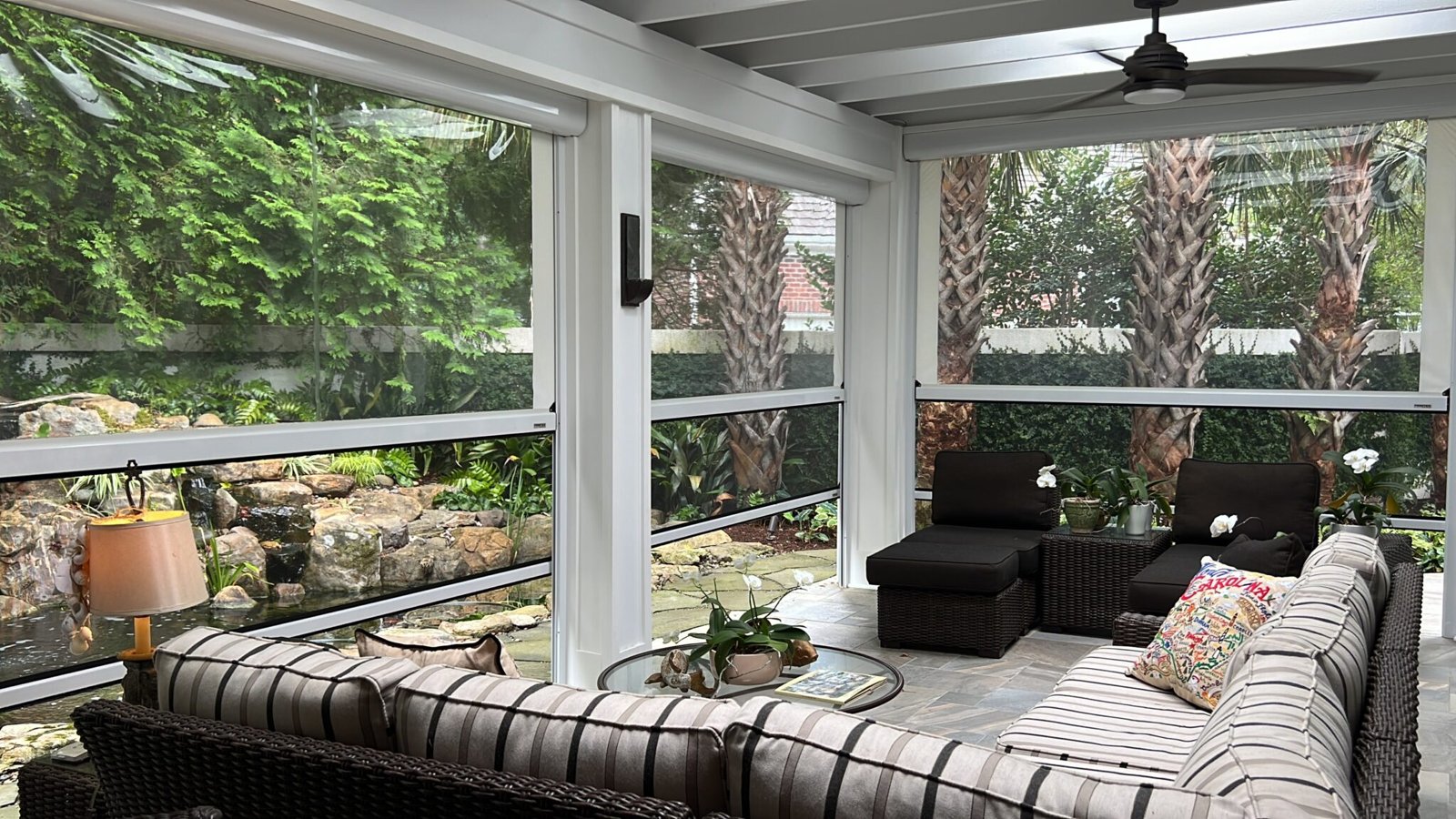 Motorized retractable screens on a porch