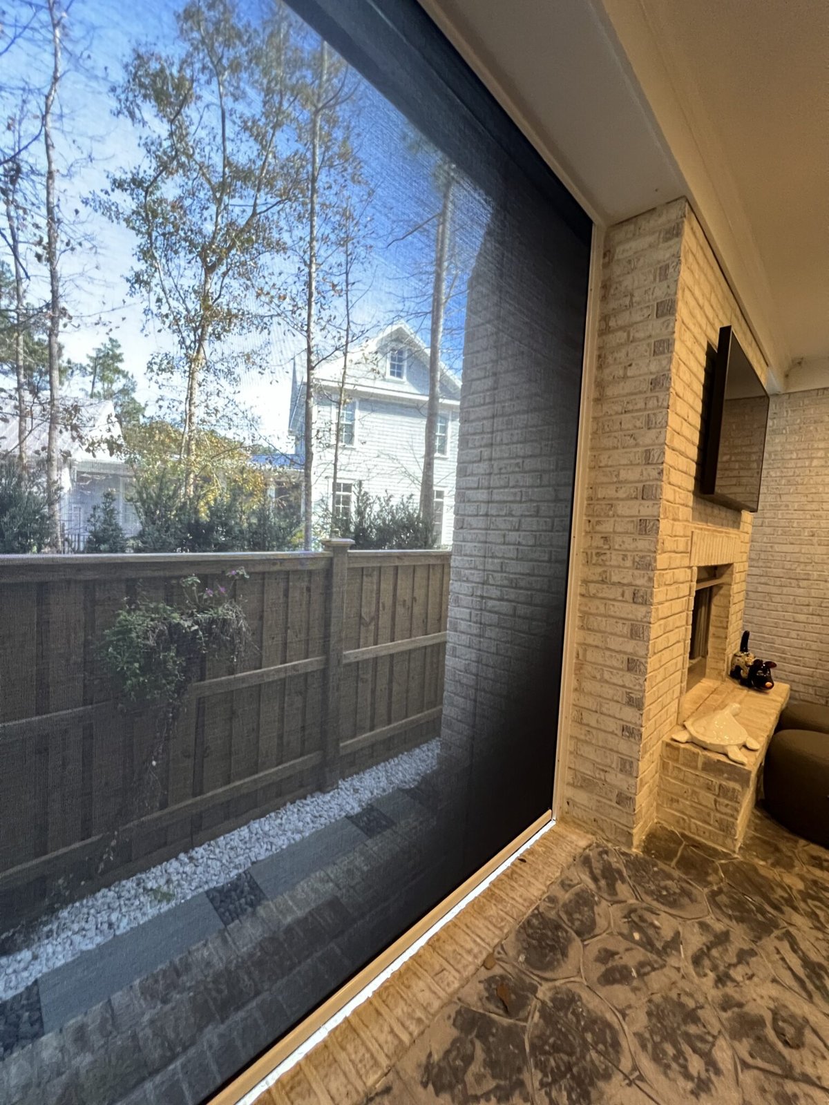 Motorized retractable screens on a porch