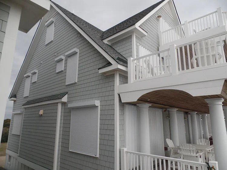 Roll shutters protecting the windows of a Wrightsville Beach area home