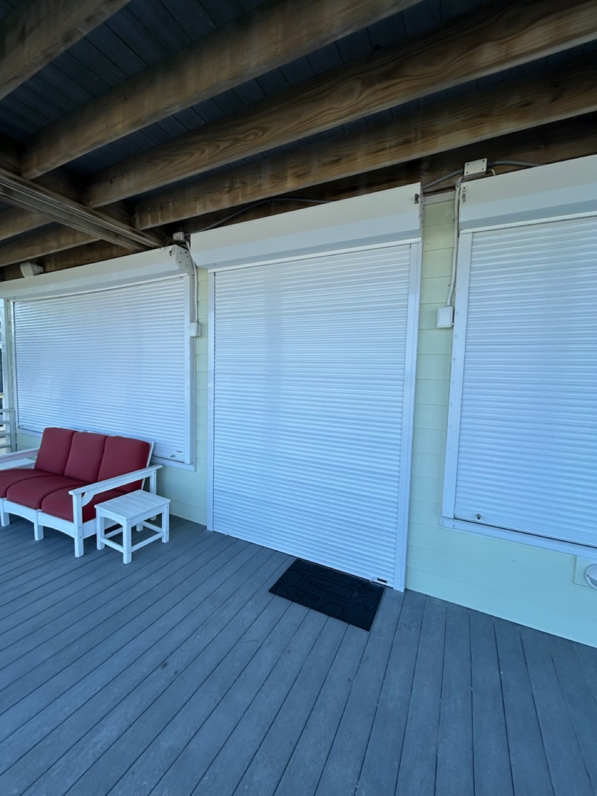 Roll shutter housing blending into the trim of a modern home