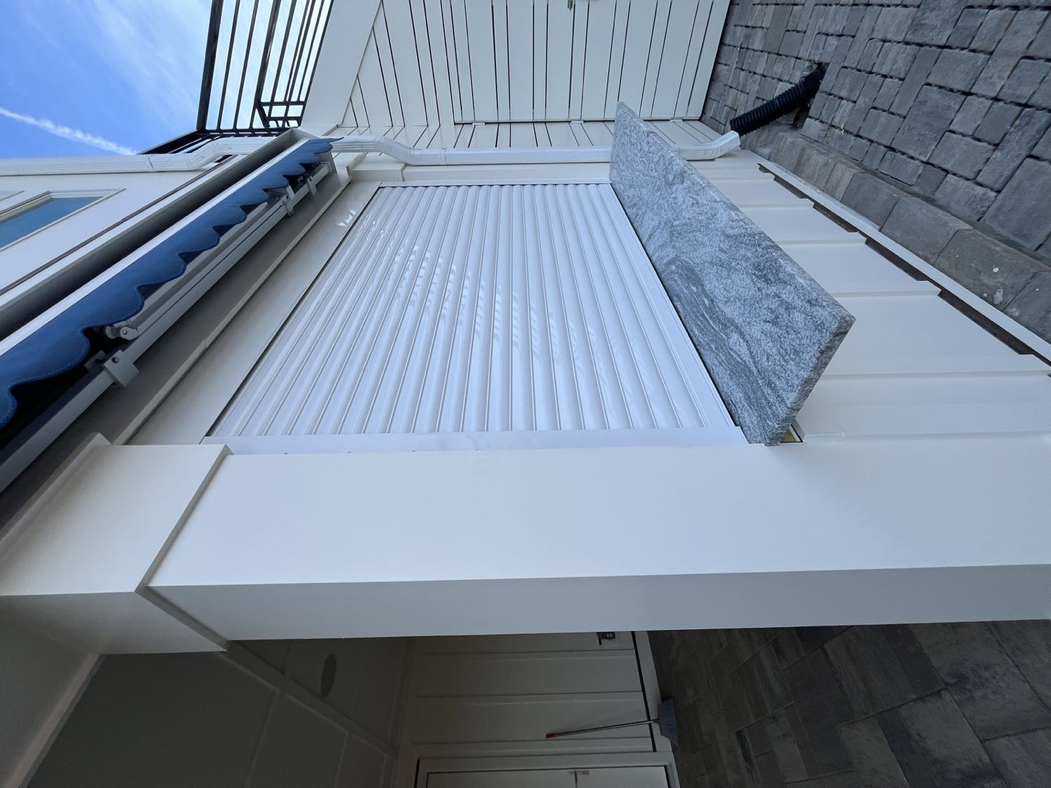 Motorized roll shutters on a coastal Carolina home