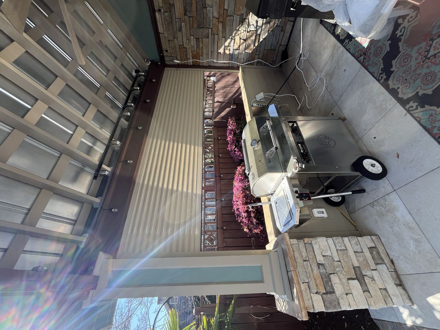 Roll shutters closed on a raised coastal beach house