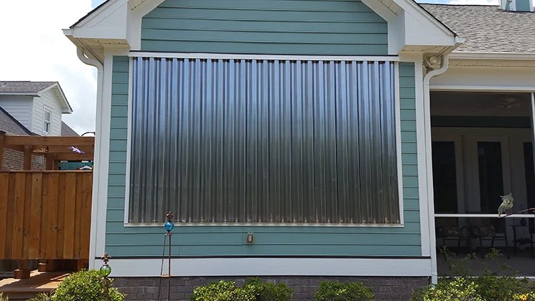 Clear and aluminum storm panels stacked for installation