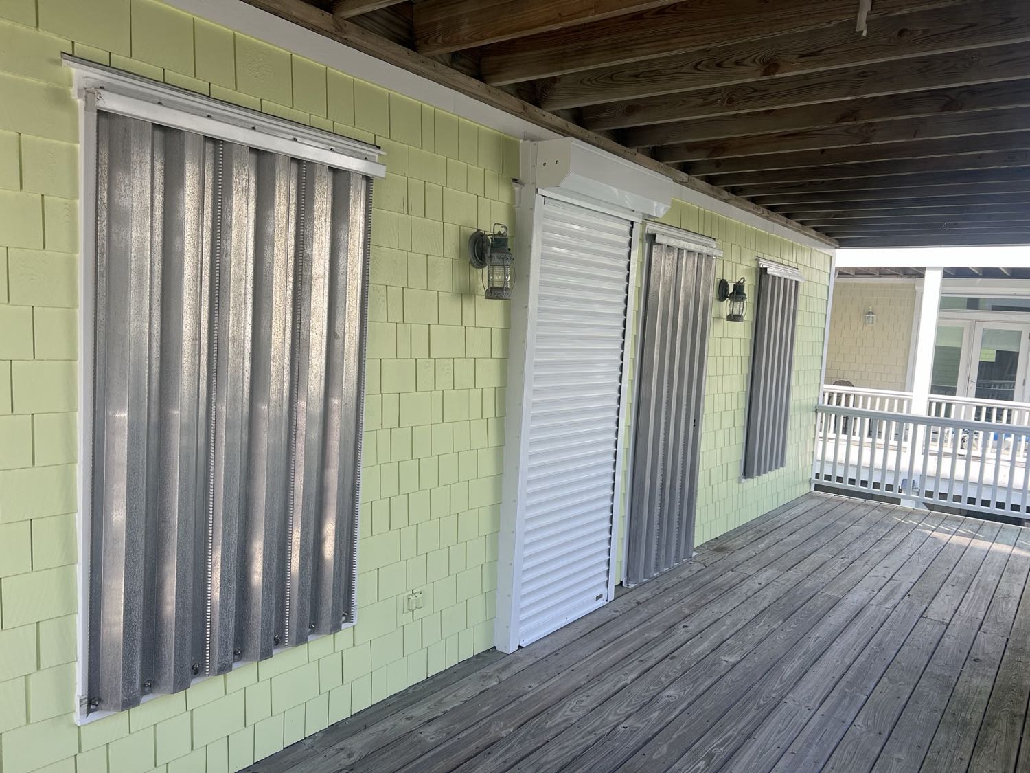 Aluminum storm panels installed over home windows