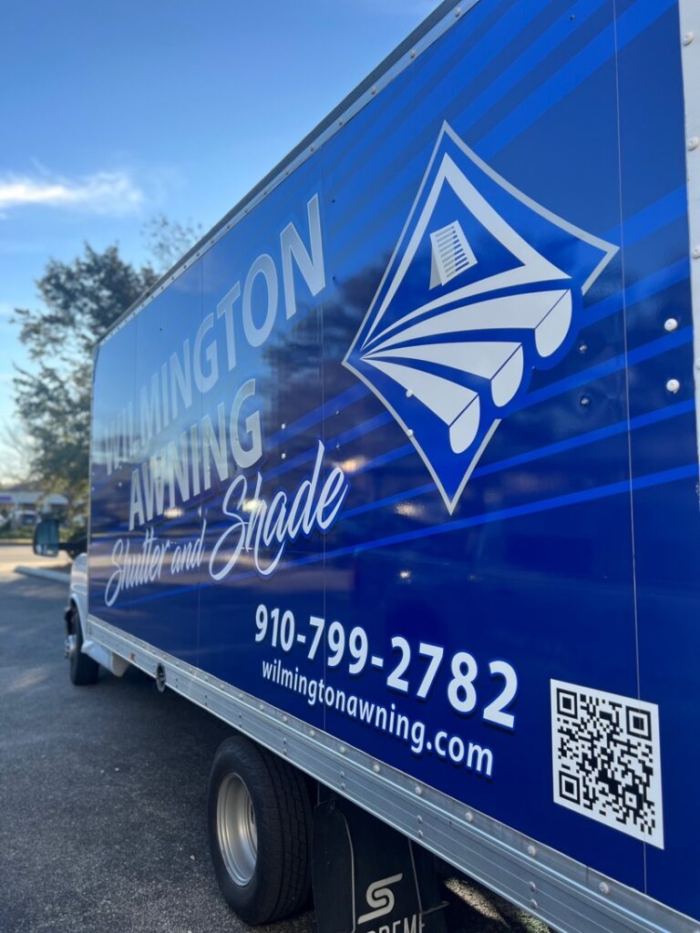 Wilmington Awning truck with logo and contact information.
